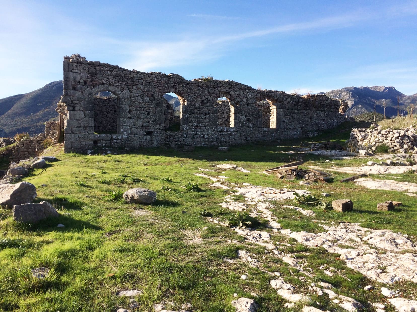 Lousios-Gorge-karytaina-Castle-ruins on a green hill