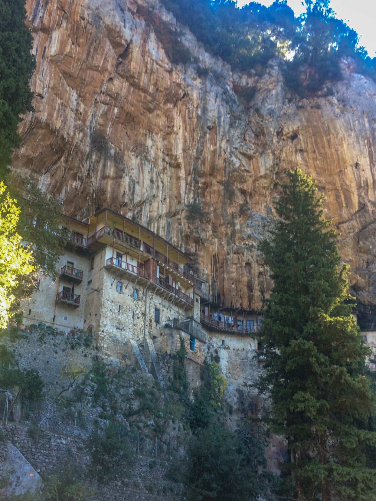 buildings built on the steep side of a rocky mountain