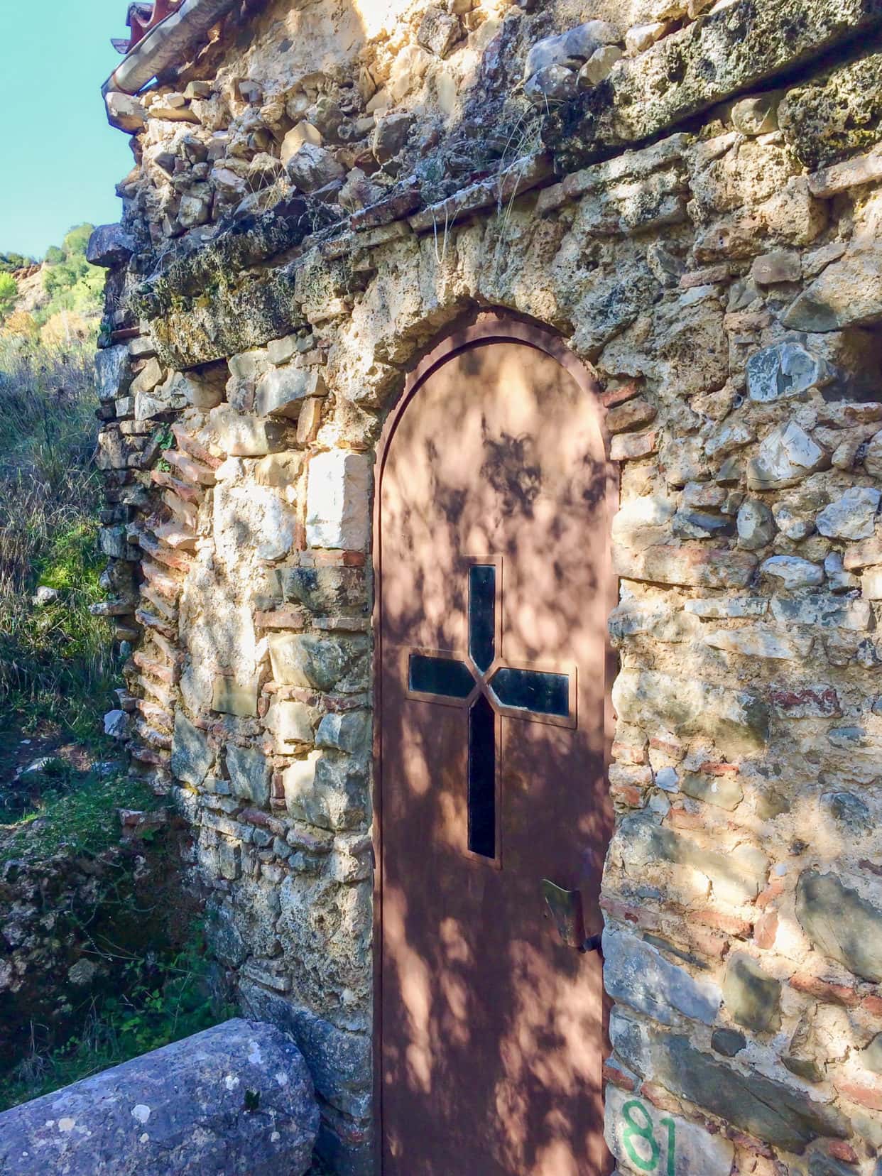 wooden church door with stone walls
