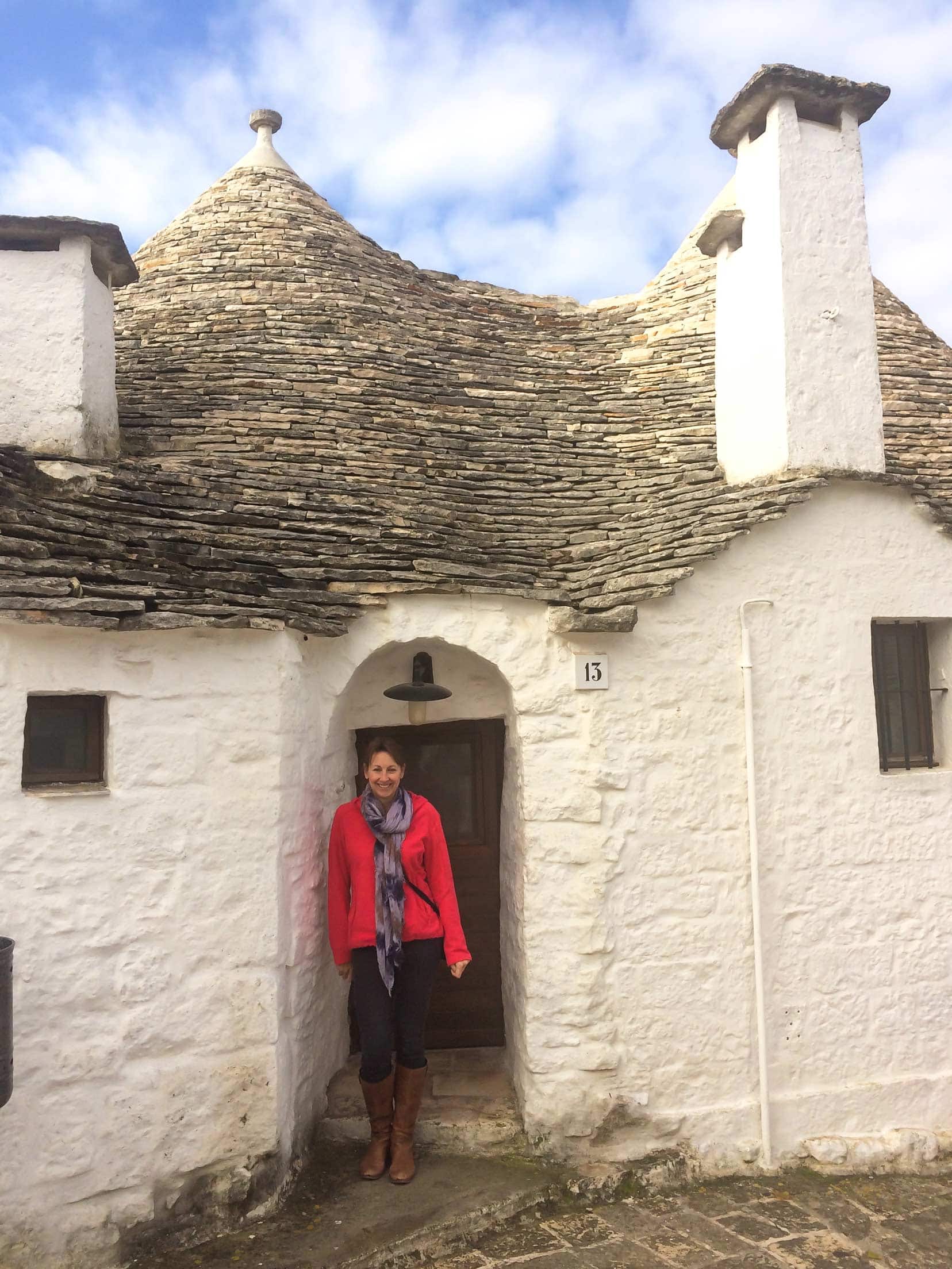 Shelley stood in doorway of a trulli