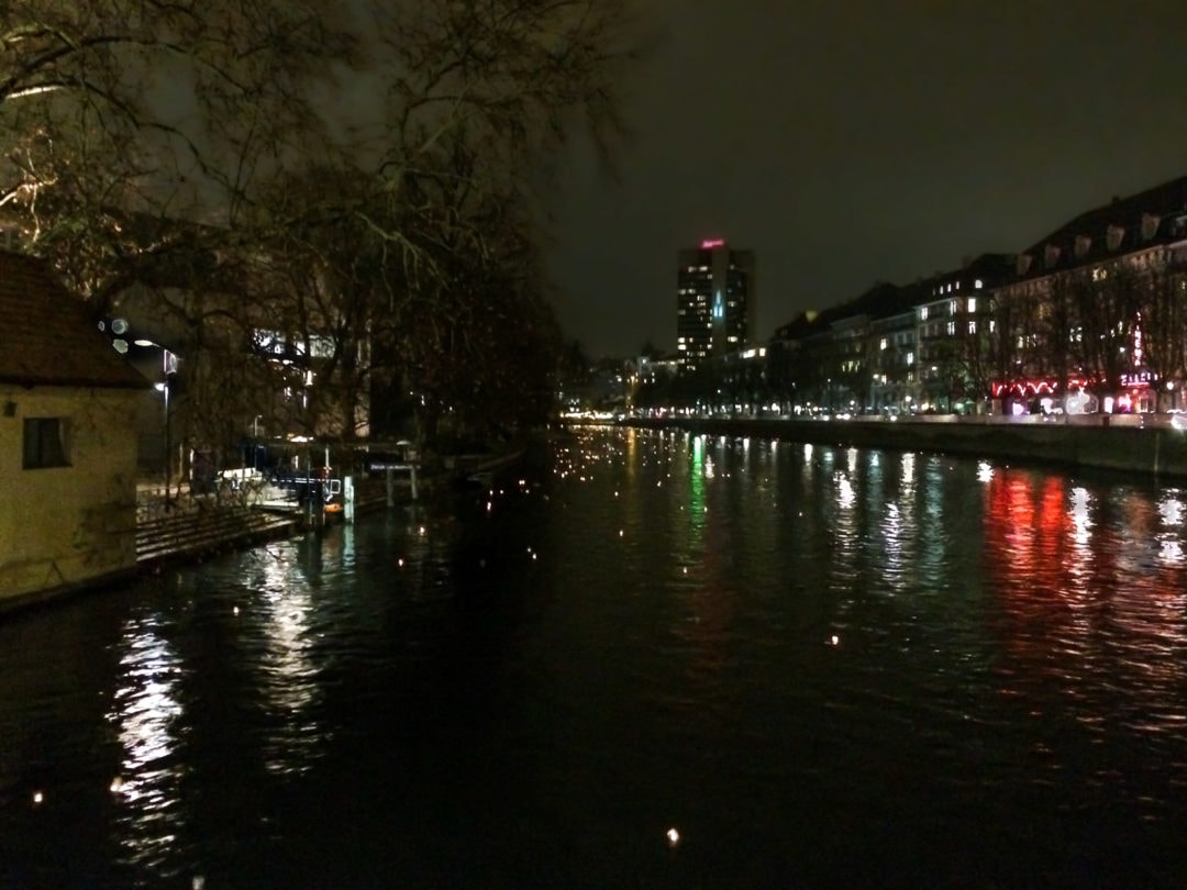 lanterns-floating-down-a-river-at-night