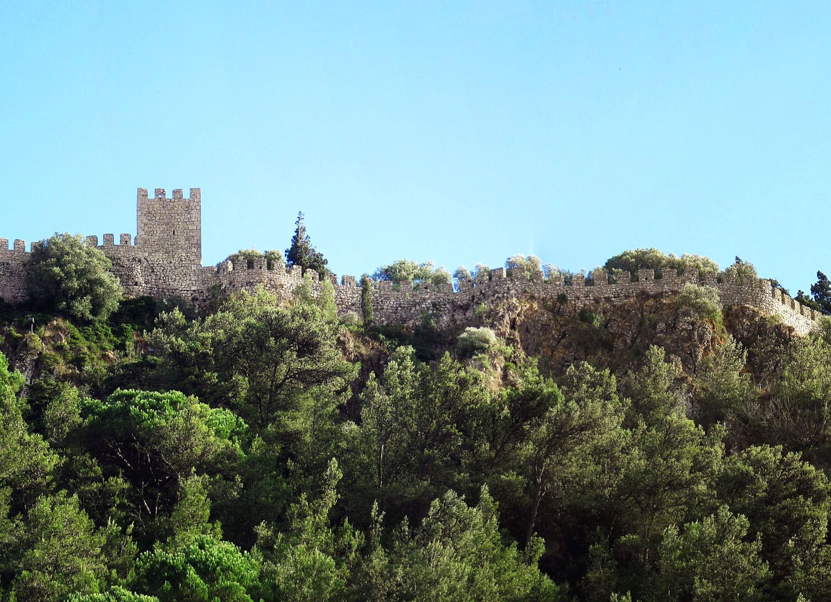 Sesimbra castle walls at the of of a hill