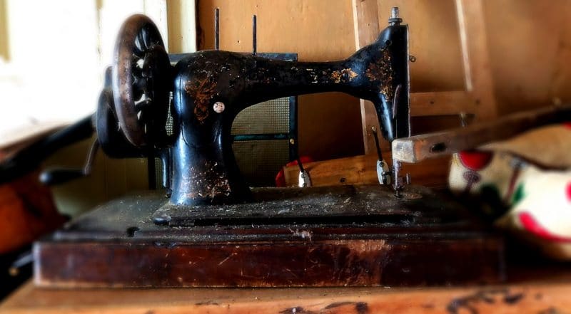 An old antique black and brown sewing machine