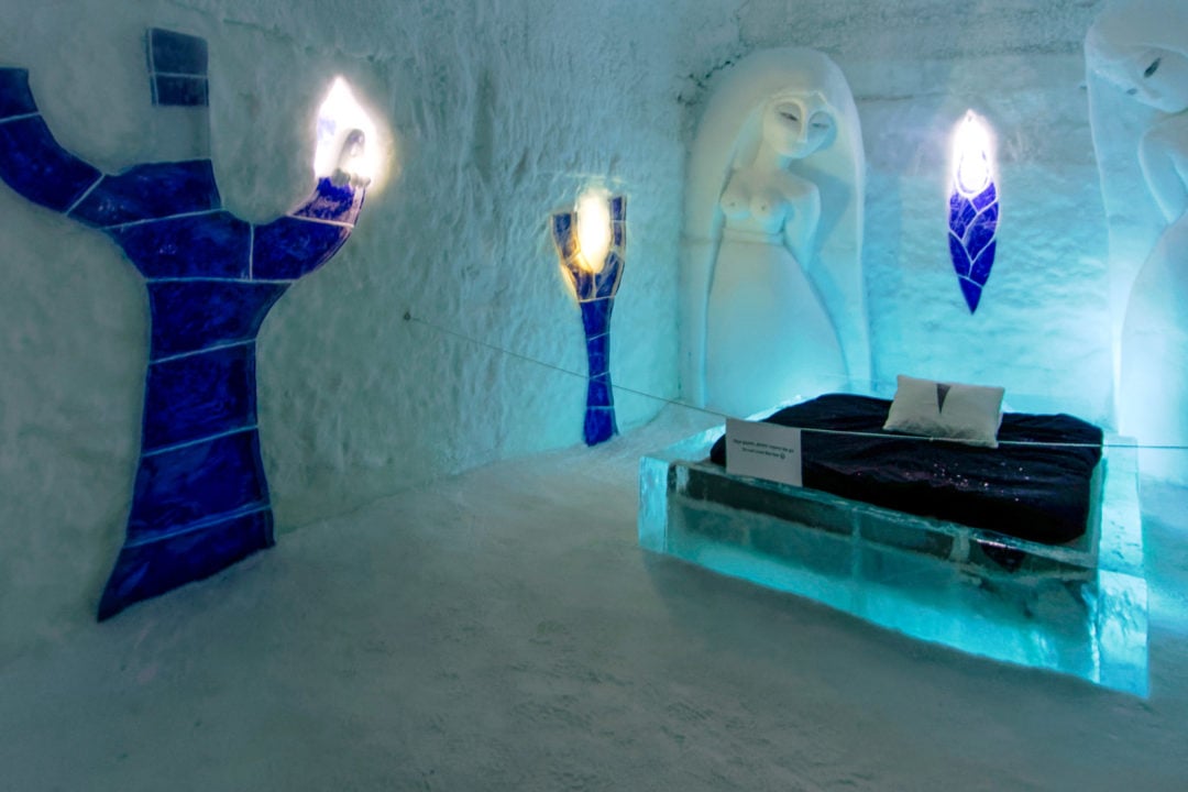 two-ice-sculpture-woman-figures-overlooking-an-ice-bed