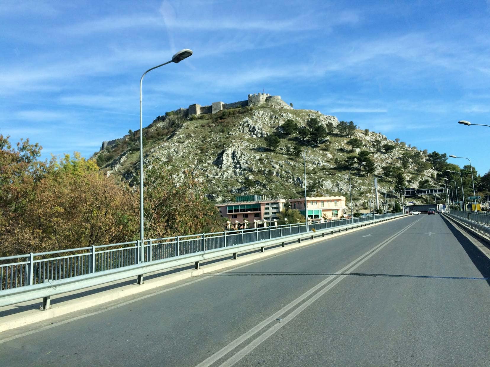 Rozafa Castle on the hill seen from the road 