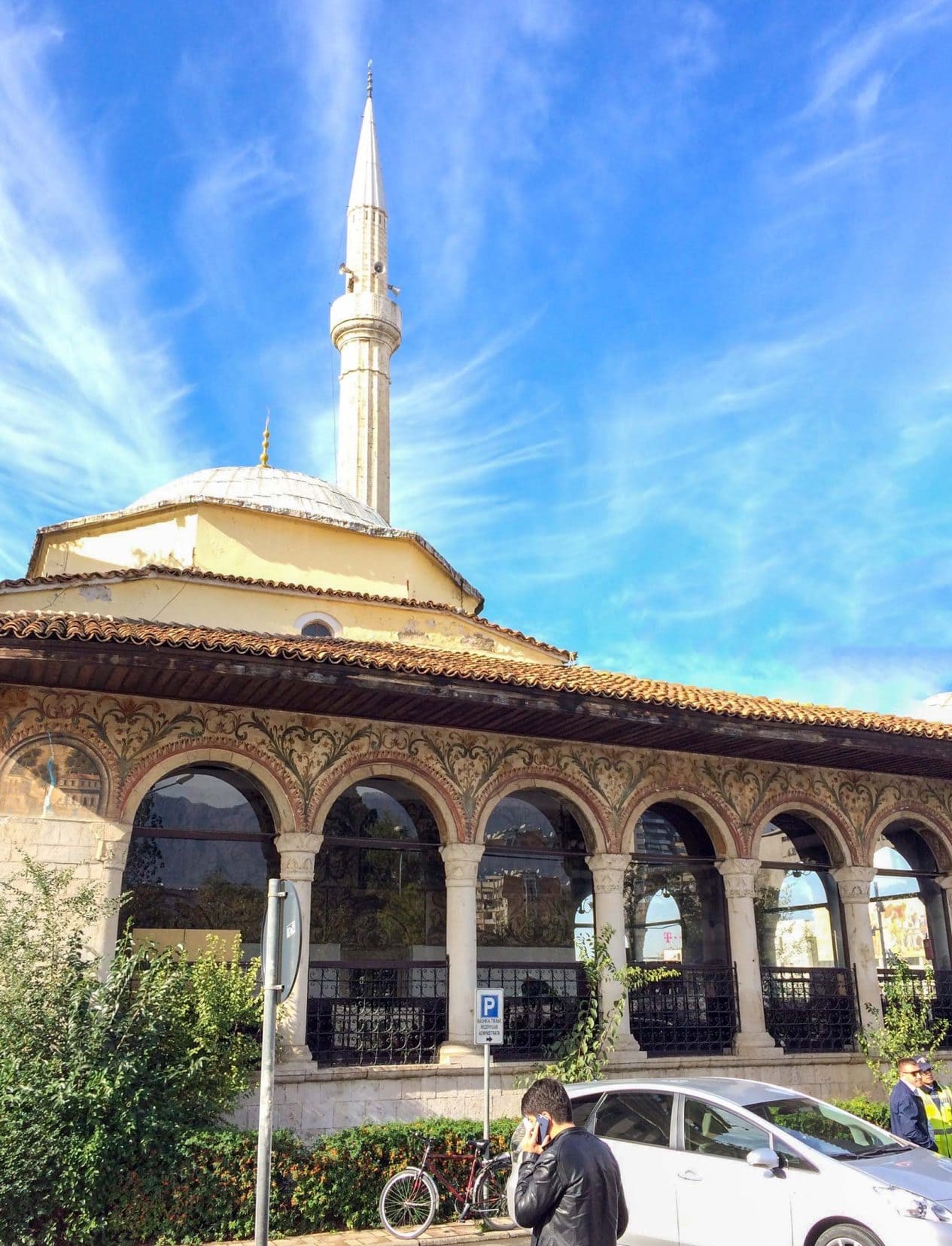 Et'hem Bey Mosque in Tirana - a building with arches decorated and a tall minuet tower 