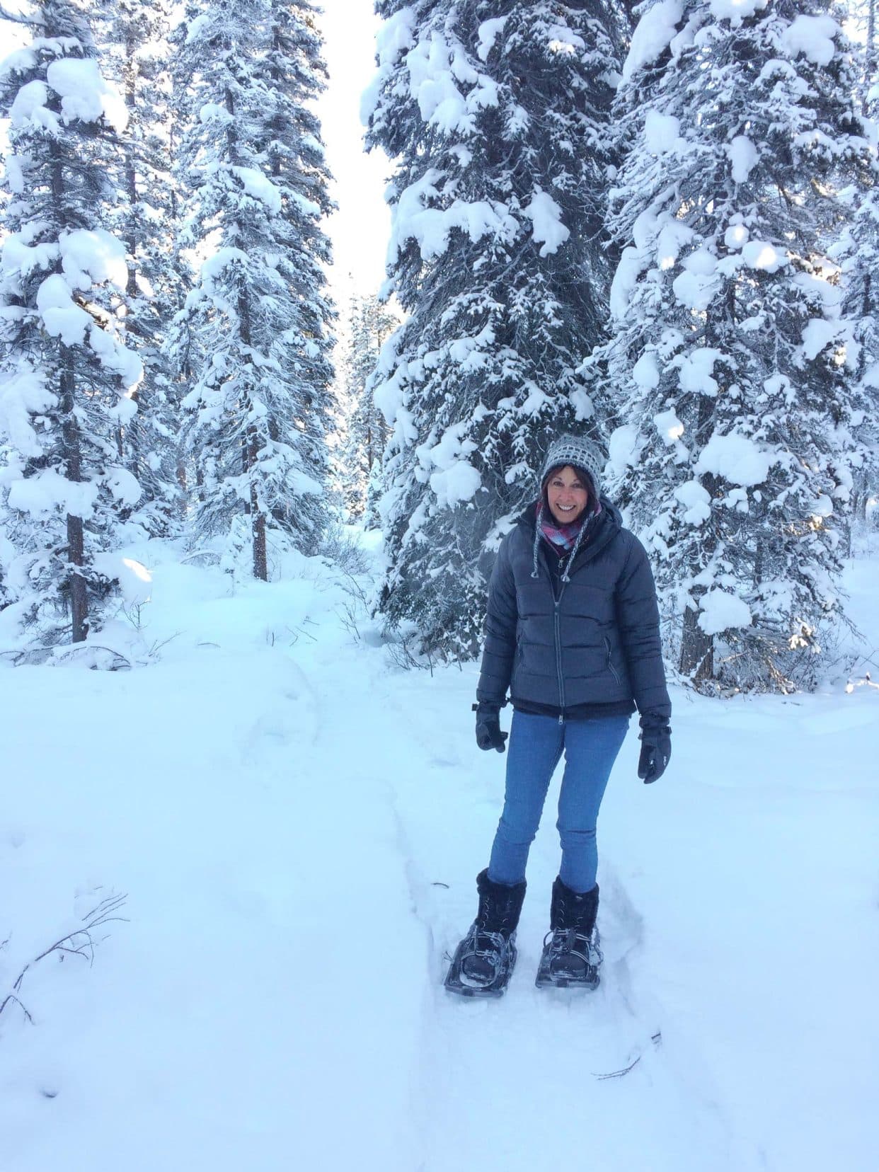 Shelley in snow shoes in the snowy forest