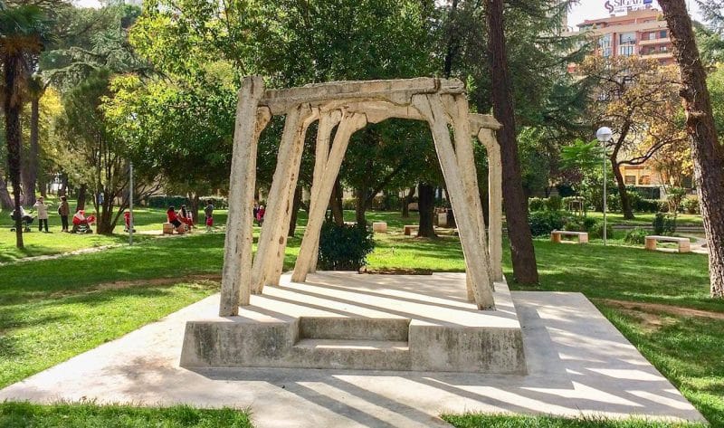 A arch like design made of cream colour pillars in Tirana, Albania