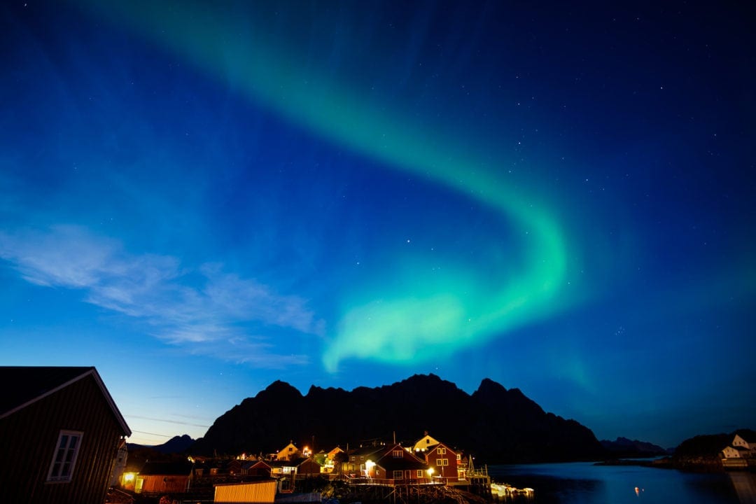 Lights over Henninsvaer with a mountain in the background