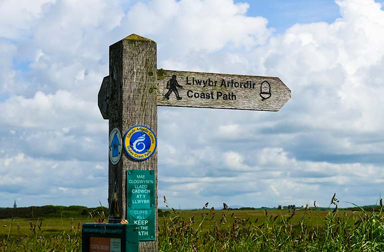 Coastal path sign in Wales on the Pembrokeshire Coastal Path