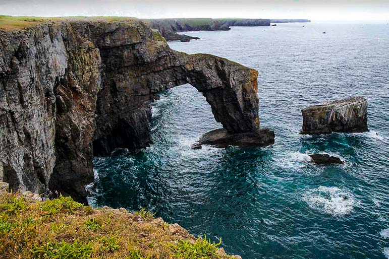 'The Green Bridge of Wales' rock formation in Wales