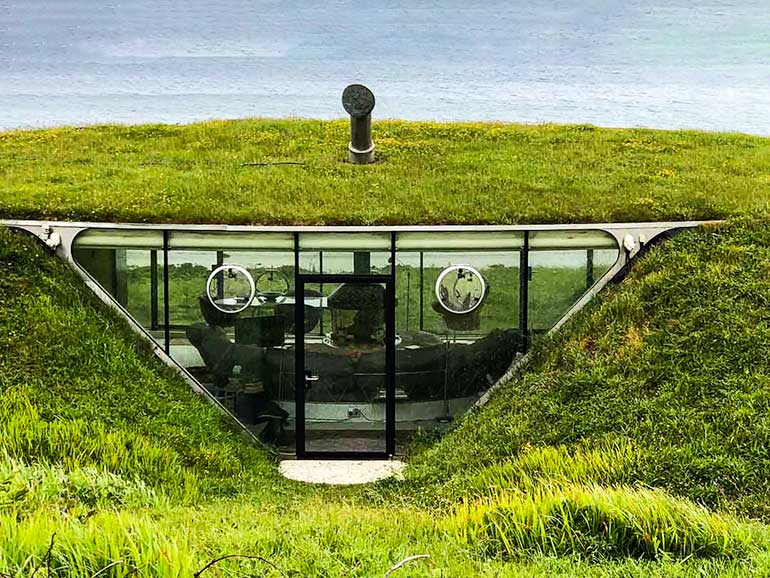 Tellytubby House in Wales with ocean in the  background.