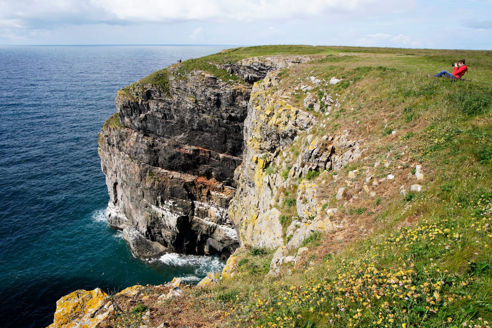 Walking along the coastal path on our Pembrokeshire itinerary - view of coastal cliffs down to the sea