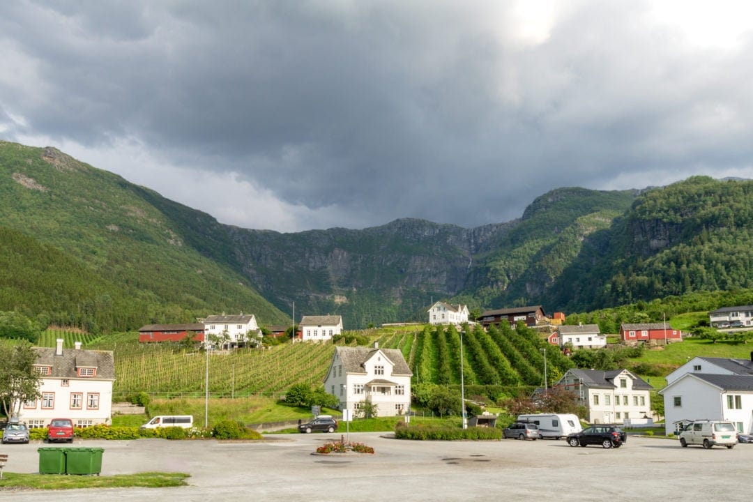 Mountain view across orchards seen from a car park