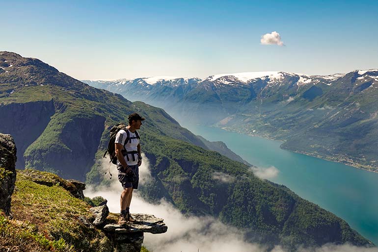 Lars looking out over the view of Sorfjorden while on the Dronningstien Hike