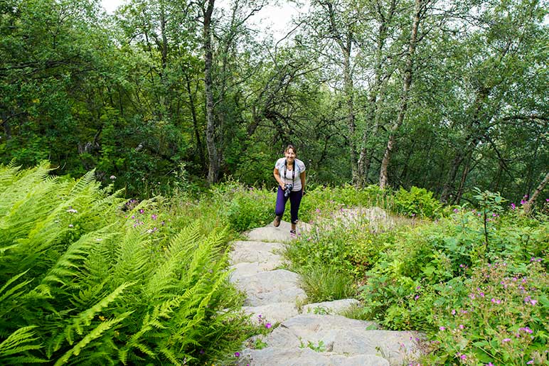 Shelley climbing the Monk steps on the Dronningstien Hike