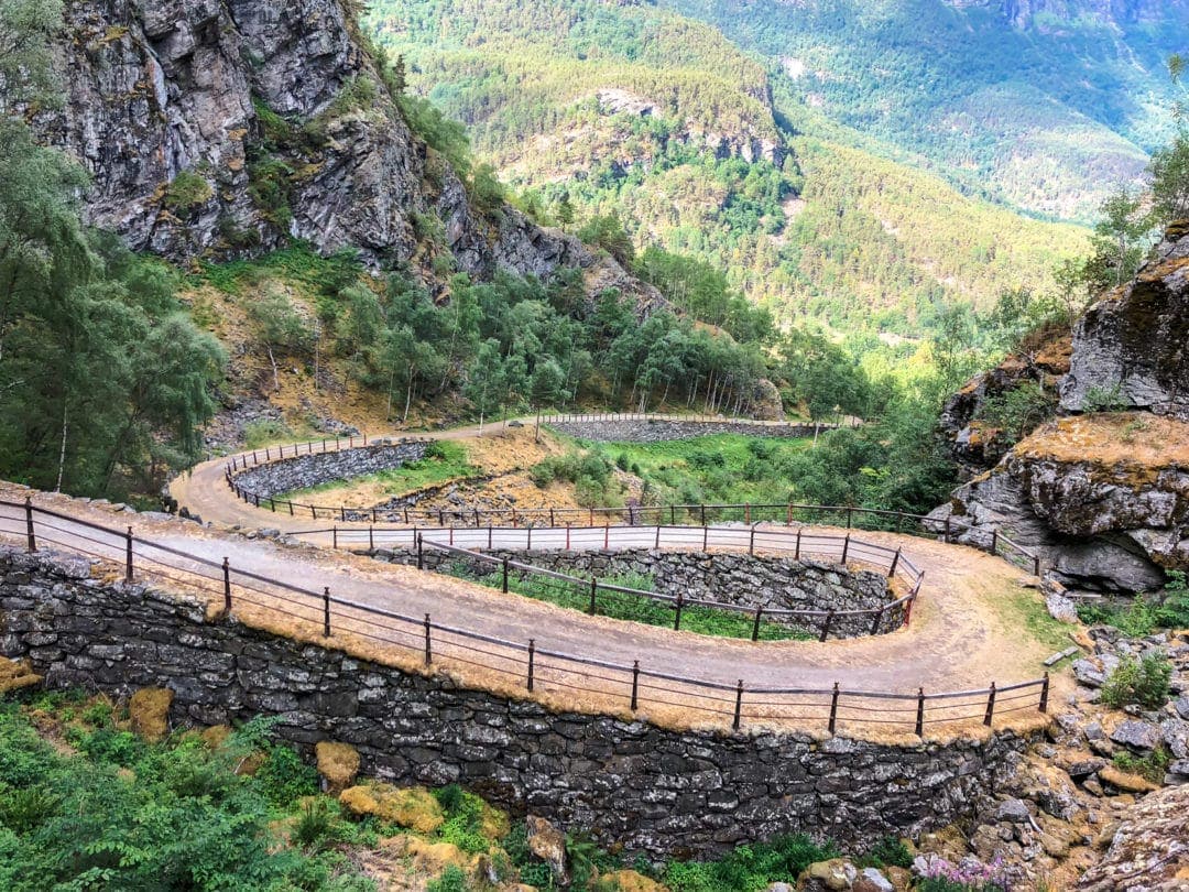 winding road built of stones with a hand rail on the edge