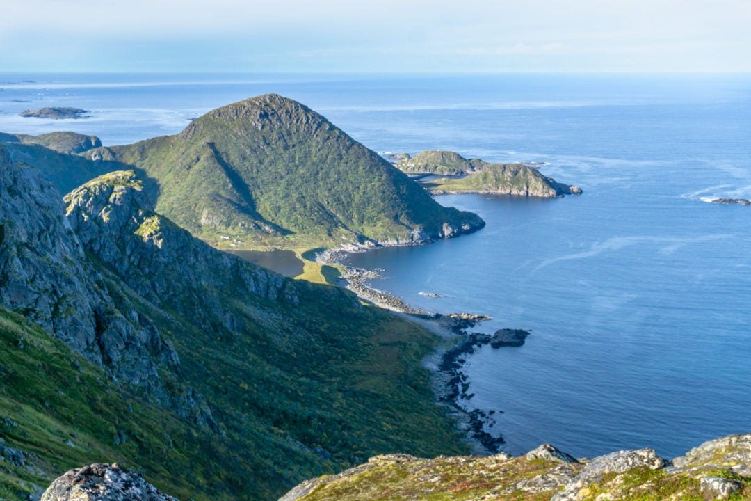 views from mountain down to a stretch of beach