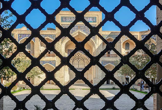 Inner courtyard of a madrasah seen through a lttice