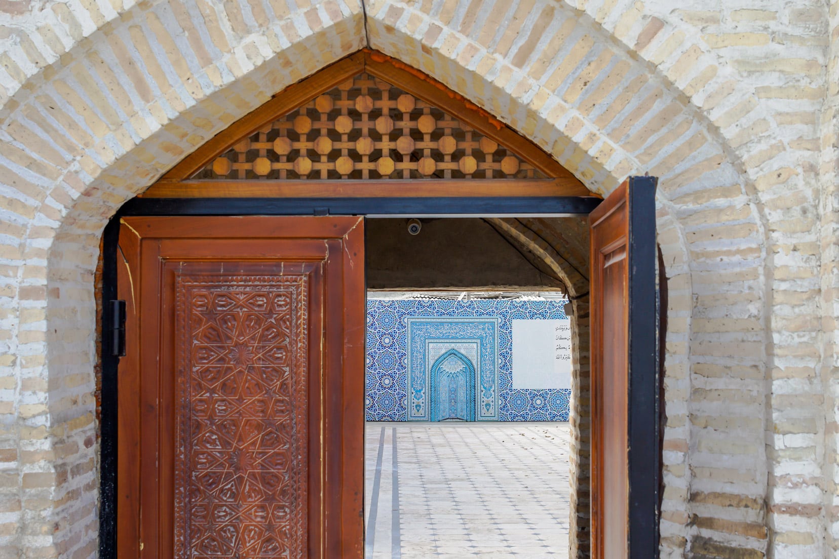 looking-through-a-door-at-an-arabic-wall-mosaic