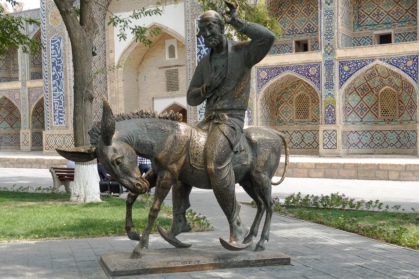 statue-of-man-sitting-on-donkey