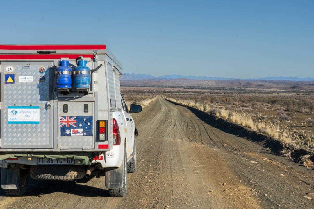 hilux on a lonely stretch of dirt road