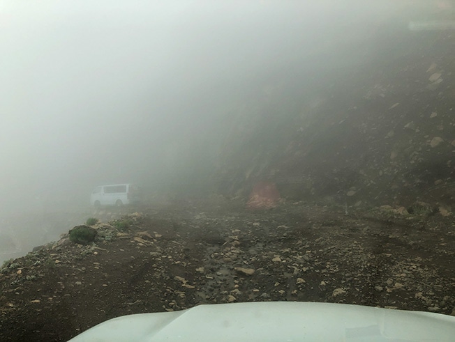 Following another vehicle on the rocky Sani Pass descent Following another vehicle on the rocky Sani Pass descent