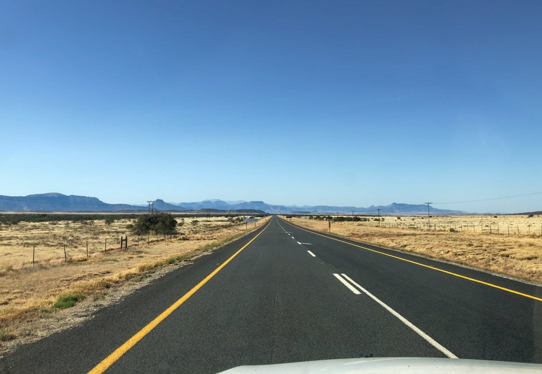 long straight bitumen road in the country