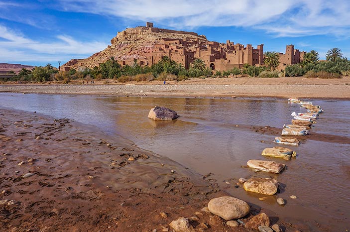 Ait Benhaddou ochre coloured earthen fort looking across a river, Morocco