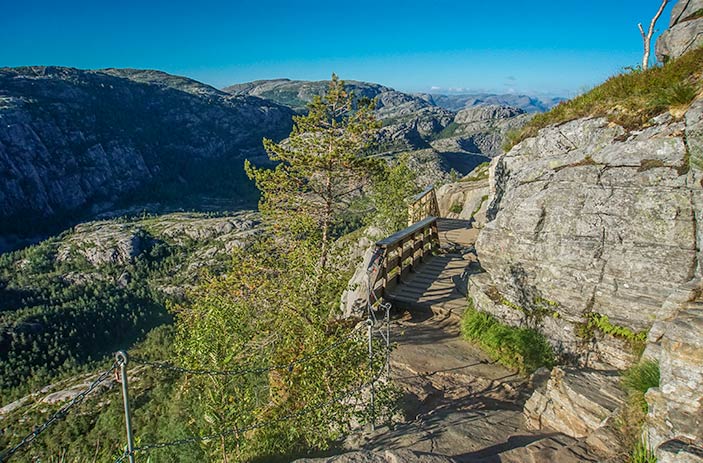 Pulpit Rock Norway Hike - bridge and hand-rail with mountain outlook