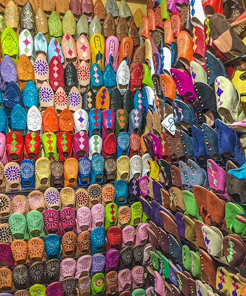 Market goods - brightly coloured slippers, Marrakech.