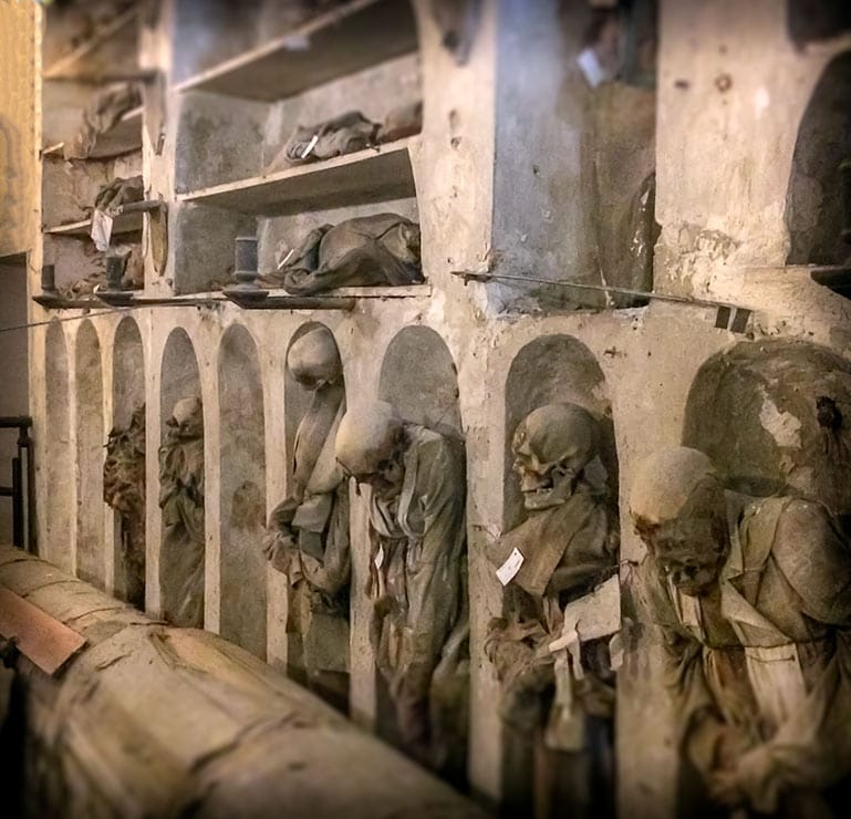 Rows of dressed corpses in the catacoms of palermo Sicily