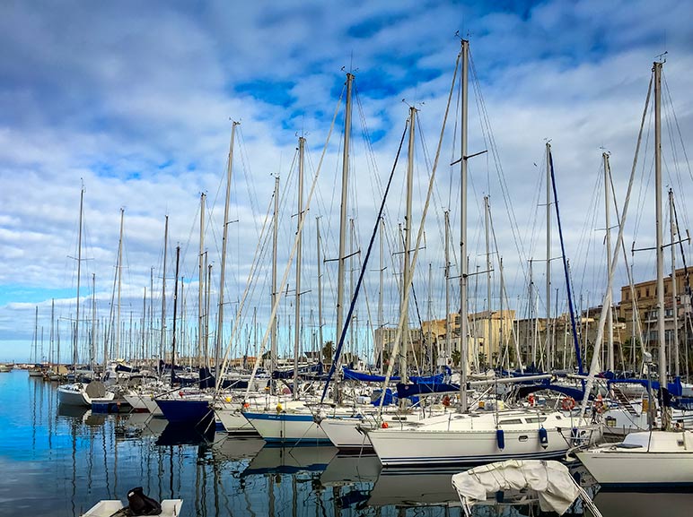 Palermo Harbour with yachts lined up in a row