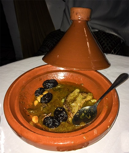 Tagine with cooked food inside it in a Riad, Marrakech