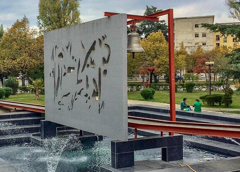 Hanging bell within a fountain, Albania Road Trip