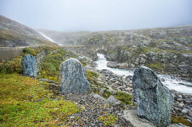 guard stones on foggy road