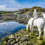 White horsemen statues on coastal strip in Norway