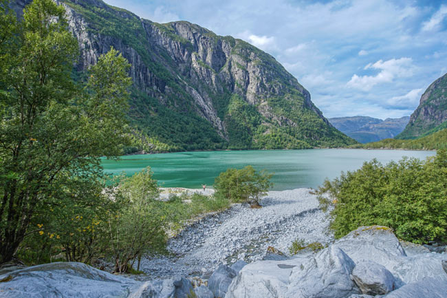 bondhusvatnet turquoise colour lake with mountains around it