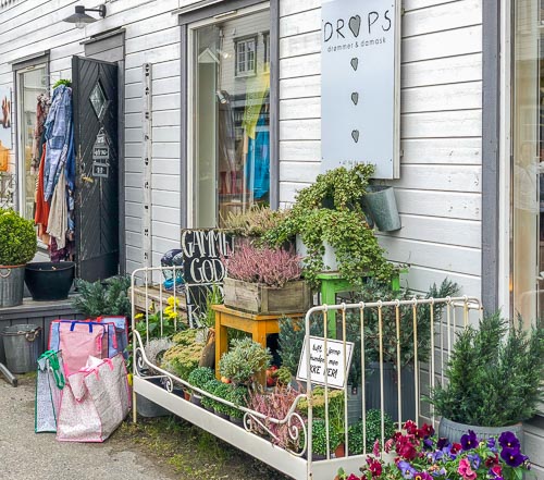 Pretty shop exterior with plants and colours