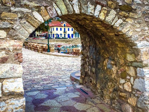 Nafpaktos harbour wall with view through to the harbour