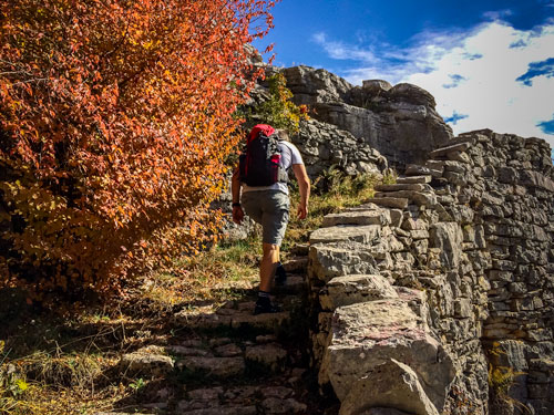 Man climbing Vradeto Steps Greece