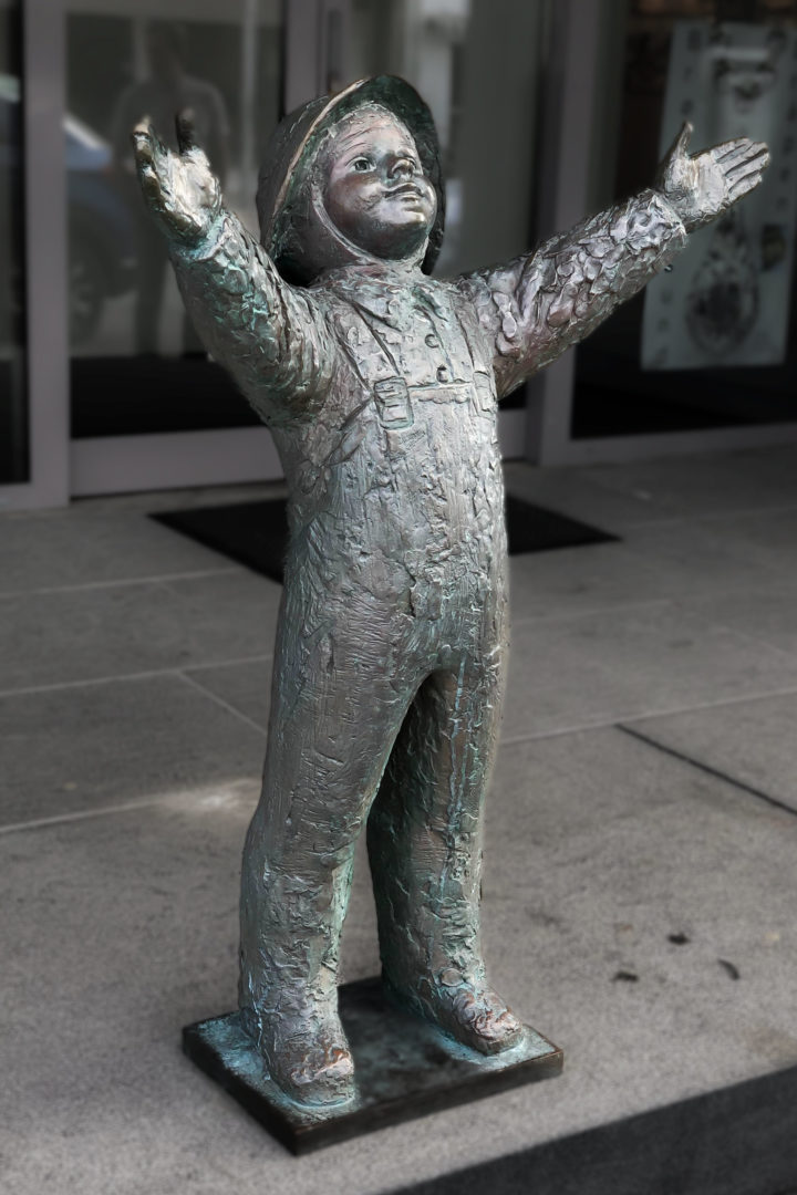 metal statue of a boy.