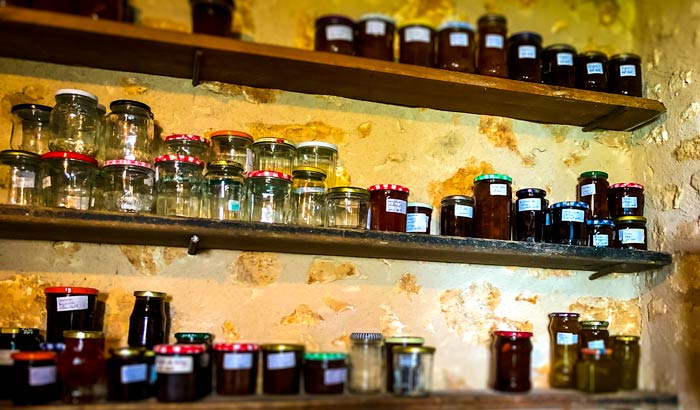 Jams-in-Villars on a French villager's  shelf as well as empty jars. 