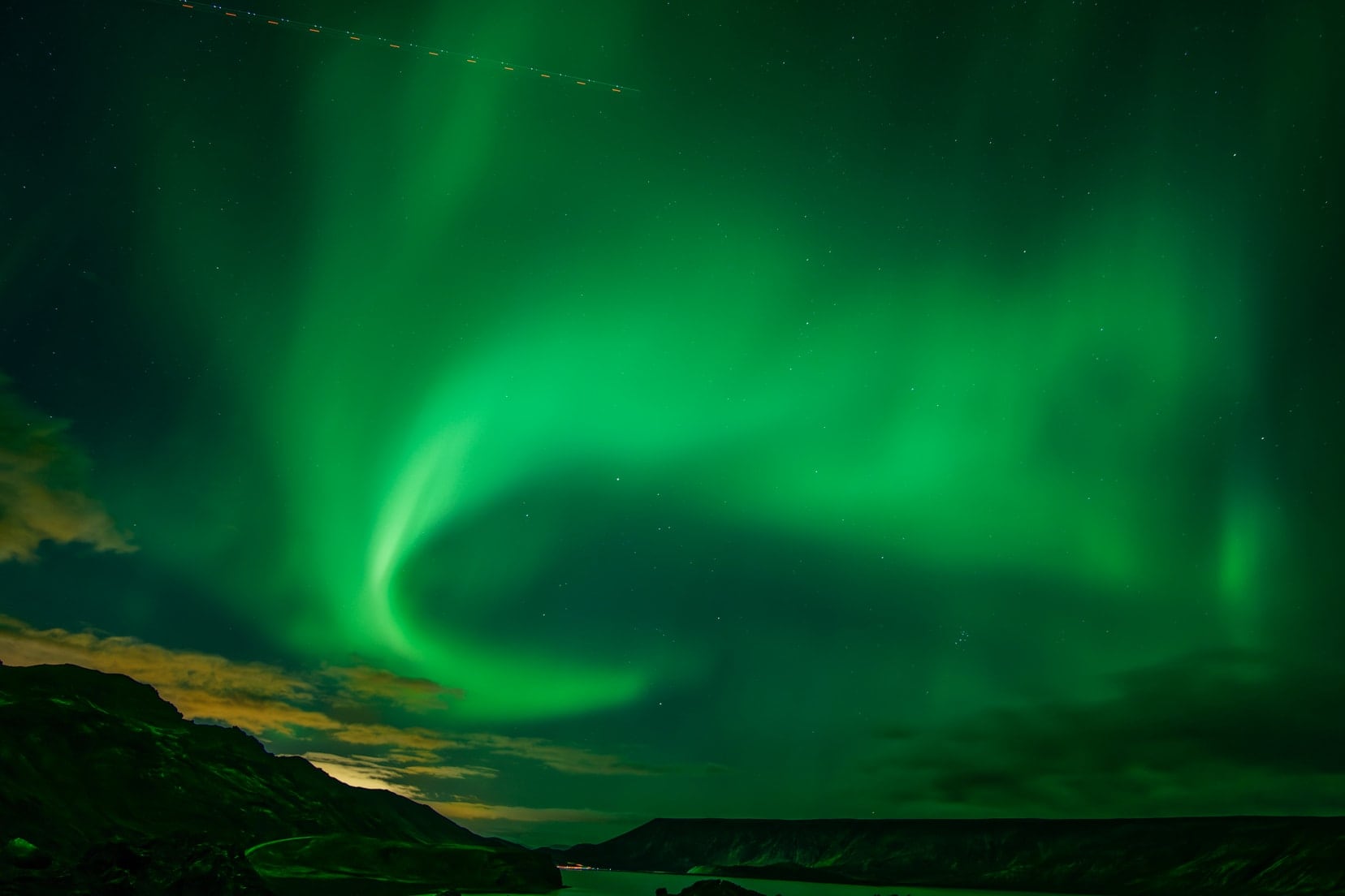 Iceland northern lights with overflying plane