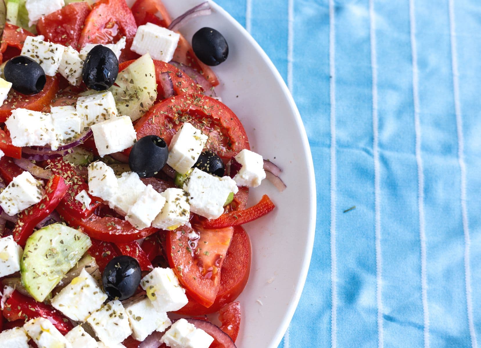 greek salad with feta cheese, olives and tomatoes