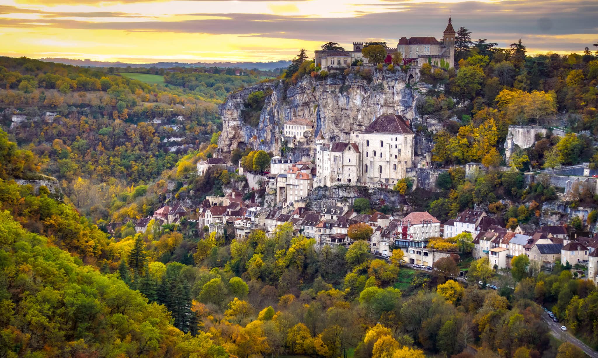 The Dordogne village of Rocamadour from a distance, perched on the rocky hill.