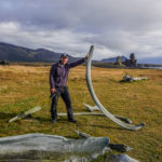 propping up a whale bone near the beach in Iceland