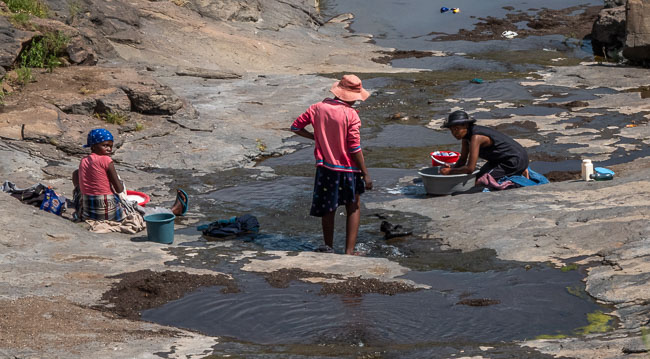 Basuto ladies washing in stream