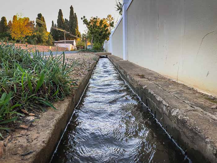 Prince ALbert leiwater channels running down the side of the pavement