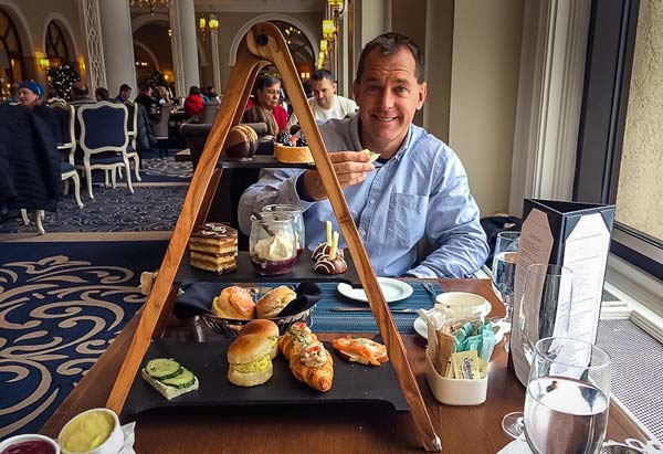 High-tea-at-Lake-Louise - a triangular stand with a selection of cakes and sandwiches